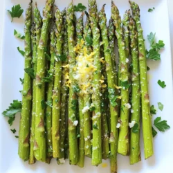 - 1 pound fresh asparagus, trimmed - 2 tablespoons extra-virgin olive oil - 3 cloves garlic, finely minced - Zest of 1 fresh lemon - Juice of 1 fresh lemon - Salt and freshly ground black pepper to taste - 1 teaspoon red pepper flakes (optional) - 2 tablespoons Parmesan cheese (optional) - Fresh parsley for garnish When I make lemon garlic roasted asparagus, I love using fresh, vibrant ingredients. The asparagus should be firm and bright green. Trim the tough ends so the spears cook evenly. The olive oil is key for a rich flavor. I prefer extra-virgin olive oil for its fresh taste. Garlic adds depth to the dish. Mince it finely to release all its flavor. The zest of a lemon brings brightness. It enhances the asparagus without making it too sour. Fresh lemon juice balances the garlic and oil. If you like a little heat, add red pepper flakes. They give a nice kick. Parmesan cheese can add a creamy touch. It melts beautifully on hot asparagus. Finally, fresh parsley is great for garnish. It adds color and freshness to the dish. These simple ingredients come together for a delicious side dish. You can find the full recipe for lemon garlic roasted asparagus in the previous section. Enjoy! - Preheat the oven to 425°F (220°C). - Rinse and trim the asparagus. Start by preheating your oven. This ensures the asparagus cooks evenly. Rinse the asparagus under cold water to remove any dirt. Trim the tough ends by snapping them off or cutting them. This gives you tender bites. - Whisk together olive oil, garlic, lemon zest, juice, salt, and pepper. - Add red pepper flakes if desired. Next, grab a mixing bowl. Add the olive oil, minced garlic, lemon zest, lemon juice, salt, and pepper. Whisk it together until it blends well. The mix should smell fresh and bright. If you like heat, throw in some red pepper flakes. It adds a nice kick. - Toss asparagus in the dressing and arrange on a baking sheet. - Roast for 12-15 minutes, stirring halfway through. - Add Parmesan cheese in the last two minutes if using. Now, add the trimmed asparagus to the bowl. Toss it well so each piece is covered in the dressing. Spread the asparagus out on a baking sheet. Make sure they are in a single layer for even cooking. Place the sheet in the oven. Roast for 12-15 minutes, giving them a stir halfway through. This helps them cook evenly. If you want to add Parmesan cheese, sprinkle it on in the last two minutes. This gives a creamy finish. For the complete recipe, check out the Full Recipe to create this zesty dish that pairs well with many meals! Choosing the right size of asparagus is key. Thinner spears cook faster, while thicker ones take longer. Aim for medium-sized spears for even cooking. Spacing is also important. Place asparagus in a single layer on the baking sheet. This ensures each spear gets hot air for even roasting. If they touch, they will steam instead of roast. You can enhance the flavor by adding herbs. Try fresh thyme or rosemary for a twist. You can also use spices like paprika for a smoky taste. Substituting oils can change the flavor profile too. Use avocado oil for a buttery taste. Adding extra lemon zest brightens the dish and gives it a fresh kick. A common mistake is overcrowding the baking sheet. This causes the asparagus to steam instead of roast. Always give them space to cook evenly. Another mistake is not preheating the oven. If the oven isn't hot, the asparagus won’t cook well. Always preheat to 425°F (220°C) for the best results. For the full recipe, check out the recipe section above. {{image_4}} You can mix asparagus with other tasty veggies. Try adding cherry tomatoes for sweetness. Bell peppers add crunch and color. Carrots bring a nice texture. Toss in any of these to your lemon garlic roasted asparagus. You will enjoy a fresh and vibrant side dish. Seasons change, and so can your dish. In spring, add fresh herbs like dill or basil. In summer, toss in zucchini or corn for a bright twist. Fall is great for adding roasted butternut squash. Winter calls for hearty greens like kale. Using seasonal ingredients makes your dish burst with flavor. Want to make your dish gluten-free? No problem! The recipe is already gluten-free. Just skip the cheese or choose a dairy-free substitute for a vegan option. You can use nutritional yeast for a cheesy flavor without dairy. Adjusting your recipe makes it fit any diet! To keep your roasted asparagus fresh, place it in an airtight container. You can store it in the fridge for up to three days. Make sure to cool it down before sealing. This helps prevent sogginess. If you want to enjoy it later, try to keep the flavors intact. When it comes time to eat your leftovers, aim to keep the texture. I suggest reheating in the oven. Set your oven to 350°F (175°C). Place the asparagus on a baking sheet. Heat for about 10 minutes. This way, it stays crisp and tasty. You can also use a skillet over medium heat. Just warm it gently, stirring often. If you want to freeze your asparagus, start by letting it cool completely. Then, lay the spears flat on a baking sheet. This prevents them from sticking together. Freeze them for about two hours. After that, transfer them to a freezer bag. They can last up to three months. When you’re ready to eat, thaw in the fridge overnight before reheating. Cooking lemon garlic roasted asparagus takes about 12-15 minutes. First, preheat your oven to 425°F (220°C). Once you place the asparagus in the oven, stir them halfway through. This helps them cook evenly. You want them tender yet still crisp. For best results, check them around the 10-minute mark. If they look bright green and tender, they're ready! Yes, you can use frozen asparagus, but it cooks differently. Frozen asparagus often has more water. It may become softer and mushy. If you use frozen, roast it straight from the freezer. Add a few extra minutes to the cooking time. This ensures they heat through and get a bit crispy. However, fresh asparagus will give you the best flavor and texture. Lemon garlic roasted asparagus pairs well with many dishes. Here are some ideas: - Grilled chicken or fish - Beef or pork steaks - Quinoa or rice dishes - Pasta with lemon or garlic - Other roasted veggies like carrots or potatoes This side dish adds a fresh and bright flavor to any meal. Absolutely! You can customize this dish to suit your taste. Here are a few ideas: - Add nuts like almonds or pine nuts for crunch - Use different cheeses, like feta or goat cheese, for a tangy twist - Mix in other herbs like thyme, rosemary, or dill for extra flavor - Toss in cherry tomatoes for a pop of color and sweetness Experimenting with these options can make your lemon garlic roasted asparagus even more exciting. For the full recipe, check out the [Full Recipe]. Lemon garlic roasted asparagus is simple and tasty. Start with fresh ingredients, and follow the steps closely for great results. Remember to space the asparagus well on the baking sheet and avoid overcrowding. You can also mix in other veggies or spices for new flavors. Store leftovers properly and reheat them for later enjoyment. This dish suits many meals and diets. With these tips, you'll impress everyone with your cooking skills. Enjoy your delicious creation!