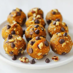 To make Pumpkin Pie Energy Bites, you need these simple ingredients: - 1 cup rolled oats - 1/2 cup pumpkin puree - 1/4 cup almond butter (or peanut butter) - 1/4 cup honey or maple syrup - 1 teaspoon pumpkin pie spice - 1/2 teaspoon pure vanilla extract - 1/4 cup mini chocolate chips (optional) - 1/4 cup chopped nuts (optional) - A pinch of salt These ingredients blend together to create a tasty treat. The oats provide fiber, while pumpkin puree gives moisture and flavor. Almond butter or peanut butter adds healthy fats and protein. Honey or maple syrup sweetens the bites. The pumpkin pie spice brings the warm flavors of fall, making each bite feel cozy. If you want something sweet, add mini chocolate chips. For crunch, toss in chopped nuts like walnuts or pecans. The pinch of salt enhances all the flavors. Gather these ingredients, and you are ready to create a snack that is both fun and healthy! First, grab a large mixing bowl. In it, combine 1 cup of rolled oats with 1/2 cup of pumpkin puree. This mix forms a hearty base. Next, add 1/4 cup of almond butter. If you prefer, you can use peanut butter instead. Then, pour in 1/4 cup of honey or maple syrup for sweetness. Use a spatula or wooden spoon to mix everything until it feels smooth and well combined. Now it’s time to add flavor! Sprinkle in 1 teaspoon of pumpkin pie spice and 1/2 teaspoon of pure vanilla extract. These spices will give the bites their warm, cozy taste. Don’t forget to add a pinch of salt; it really enhances the flavor. If you want a little extra fun, you can mix in optional ingredients like mini chocolate chips or chopped nuts. With clean hands, scoop out about 1 tablespoon of the mixture. Roll it into a ball shape. Place each ball onto a parchment-lined baking sheet. Make sure to leave space between the balls. This helps them keep their shape while chilling. Once all the bites are formed, it’s time to chill. Pop the baking sheet in the fridge for at least 30 minutes. This step helps firm up the energy bites. After chilling, they are ready to eat or can be stored in an airtight container. To make your Pumpkin Pie Energy Bites stick well, mix the ingredients thoroughly. This helps bind everything together. If the mixture feels too dry, add a bit more pumpkin puree or almond butter. These tweaks ensure that every bite holds its shape and taste. Feel free to get creative with your bites! If you prefer a different nut, swap almond butter for peanut butter or sunflower seed butter. You can also change the nuts you add in. Try walnuts, pecans, or even cashews. Each nut brings its own flavor and texture, making the bites unique. You can serve these bites in fun ways. Arrange them on a colorful plate for a festive look. For a special touch, sprinkle extra pumpkin pie spice on top. These bites also pair well with a side of yogurt or fresh fruit, adding to the fun and flavor. Enjoy exploring different ways to serve and share! {{image_4}} You can easily swap almond butter for peanut butter. Both give great flavor. If you want a nut-free option, try sunflower seed butter. For sweeteners, honey is delicious, but maple syrup works too. You can even use agave syrup if you prefer. Each choice adds its own twist to the bites. To add more taste, mix in shredded coconut or chopped dried fruit. Dried cranberries or cherries add a nice chewiness. You can also try adding a tablespoon of cocoa powder for a chocolatey flavor. These changes keep the bites fun and exciting every time you make them. For a gluten-free version, use certified gluten-free oats. Be careful with cross-contamination. If you need these bites to be nut-free, swap nut butter with sunflower seed butter. Always read labels to ensure no hidden allergens. Making these changes lets everyone enjoy them without worry! To keep your pumpkin pie energy bites fresh, use an airtight container. This type of container helps keep air out. You can store them in the fridge or at room temperature for a short time. If you store them in the fridge, they will stay tastier and last longer. These energy bites stay fresh for about one week in the fridge. If you leave them out, they might only last a few days. Always check for any changes in smell or texture. If they look or smell off, it’s best to toss them. Freezing is a great option if you want to save some bites for later. To freeze, place the energy bites in a single layer on a baking sheet. Freeze them for about an hour. After that, transfer them to an airtight container or a freezer bag. They can last up to three months in the freezer. When ready to eat, just let them thaw in the fridge or at room temperature. Enjoy them any time! These bites stay fresh for about a week in the fridge. Store them in an airtight container. This keeps them tasty and prevents them from drying out. If you want to keep them longer, you can freeze them for up to three months. Just let them thaw in the fridge before you eat them. Yes, you can use fresh pumpkin! First, cook and mash the pumpkin. Steam or roast it until it's soft. This will help make it smooth. Then, mash it well to get a similar texture to the puree. Use about the same amount as the recipe calls for. Yes, these bites are a healthy snack! They are packed with nutrients. Pumpkin is high in fiber and vitamins. Oats provide whole grains for energy. Almond butter gives you healthy fats and protein. If you add nuts, you get even more nutrients. They are a great energy boost without added sugar. Absolutely! To make these bites vegan, swap honey for maple syrup. Almond butter is usually vegan, but check the label. You can also use any nut butter or seed butter. This keeps the bites tasty and suitable for a vegan diet. Enjoy making these yummy treats! You can create tasty pumpkin pie energy bites easily with these steps. We covered the key ingredients, mixing, and forming the bites. I shared tips on customizing flavors and storing them well. These bites are not just fun to make; they are also healthy. Enjoy them as a snack or a treat. Try different swaps to suit your tastes. Get started making these energy bites today!