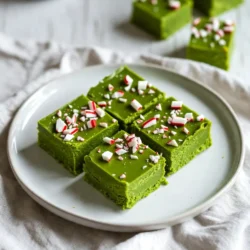 - 2 cups white chocolate chips - 1 can (14 oz) sweetened condensed milk - 1 teaspoon peppermint extract - A few drops of green food coloring - 1/2 cup crushed peppermint candies or candy canes - 1/4 cup chopped nuts (optional) - Pinch of salt To make Grinch Green Fudge, gather these simple ingredients. You need white chocolate chips for a creamy base. The sweetened condensed milk adds sweetness and a smooth texture. Peppermint extract gives that festive flavor we all love. A few drops of green food coloring turn the fudge into a fun holiday treat. Crushed peppermint candies or candy canes add a nice crunch. If you want, you can also add chopped nuts for extra texture. A pinch of salt helps balance the sweetness. With these ingredients, you can create a treat that&rsquo;s bright, fun, and perfect for sharing during the holidays. {{ingredient_image_2}} First, take an 8x8-inch baking pan. Line it with parchment paper. Leave some paper hanging over the sides. This makes it easy to lift the fudge out later. Next, grab a medium saucepan. Add the white chocolate chips and sweetened condensed milk. Place it over low heat. Stir the mixture often. This helps the chocolate melt slowly. The goal is a smooth and silky texture. Once the chocolate is melted, remove the saucepan from heat. Add one teaspoon of peppermint extract. Then, add a few drops of green food coloring. Mix it well until the fudge turns a bright green. Adjust the color to your liking. Now, it's time to add some fun! Gently fold in the crushed peppermint candies. If you like nuts, add the chopped nuts too. Mix until they are evenly spread. This adds a nice crunch to each bite. Carefully pour the fudge mixture into the lined baking pan. Use a spatula to smooth the top. Make sure it is even. Next, place the pan in the refrigerator. Let it chill for at least two hours. This helps the fudge set up firm. After it&rsquo;s set, lift it out using the parchment paper. Cut into squares and enjoy! To get the best fudge, you want it smooth and creamy. Melt the white chocolate chips slowly over low heat. Stir often to avoid burning. If it feels thick, add a bit more sweetened condensed milk. This will keep it soft and easy to cut later. For a bright Grinch green, start with just a few drops of food coloring. Mix it well and check the color. If you want it brighter, add more drops slowly. Always remember, you can add more, but you can&rsquo;t take it out! When your fudge is ready, cut it into fun shapes or squares. Place them on a bright platter. Top with extra crushed peppermint for a festive look. You can even add some holiday-themed decorations to make it special. This will impress your guests and make your table pop! Pro Tips Use Quality Chocolate: For the best flavor, choose high-quality white chocolate chips. They melt better and provide a smoother texture in your fudge. Chill Properly: Make sure to chill the fudge for at least 2 hours. This will ensure it sets properly and achieves the right consistency for cutting. Customize Your Flavor: Feel free to experiment with different extracts, such as vanilla or almond, to create a unique twist on the classic peppermint flavor. Presentation Matters: Enhance the visual appeal by adding a sprinkle of crushed peppermint on top before serving, and consider using festive packaging for gifting. {{image_4}} You can easily change the flavor of your Grinch Green Fudge. Try adding almond extract instead of peppermint. This gives your fudge a sweet, nutty taste. You can also mix in vanilla extract for a classic twist. Use your favorite flavors to create a unique treat. Toppings can make your fudge even more fun. Try adding colorful sprinkles on top for a festive look. A drizzle of melted chocolate can add a rich flavor. You can also use crushed nuts or extra peppermint candies for crunch. Be creative with your toppings to make each batch special. If you want a vegan option, swap the white chocolate chips. Use dairy-free chocolate chips instead. For the sweetened condensed milk, try coconut milk. This keeps the fudge creamy and delicious. These swaps let everyone enjoy this festive treat, no matter their diet. To keep your Grinch Green Fudge fresh, store it in an airtight container. Make sure the fudge is completely cool before placing it inside. You can layer the fudge squares with parchment paper to avoid sticking. This helps maintain its tasty texture. Grinch Green Fudge lasts about one week at room temperature. If you want it to last longer, freeze it. Wrap each piece in plastic wrap, then place them in a freezer bag. This keeps it fresh for up to three months. When ready to eat, let it thaw in the fridge overnight. You do not need to reheat the fudge. It tastes best chilled or at room temperature. If you want it softer, let it sit out for a few minutes. This will give a nice melt-in-your-mouth feel. You can tell the fudge is set when it feels firm to the touch. It should not be sticky or soft. After chilling for at least 2 hours, check it. If you press lightly and it holds shape, it's ready. Yes, you can use any color you like! Just remember, it will change the look of your fudge. For a fun twist, try red or blue. Just add a few drops and mix until you reach the shade you want. Absolutely! You can make this fudge a few days ahead of time. Just store it in an airtight container in the fridge. This way, it stays fresh and tasty for your holiday gatherings. If you want a different flavor, try using butterscotch or dark chocolate chips. Just melt them in the same way as white chocolate. This will change the taste, but it will still be delicious! This blog post covered how to make Grinch Green Fudge, from start to finish. You learned about the key ingredients and step-by-step instructions. We shared tips for perfect consistency and fun variations to try. Plus, you got storage info to keep your fudge fresh. Making fudge is fun and easy. You can impress friends and family with your tasty treat. Remember, creativity is key, so don&rsquo;t be afraid to mix things up. Enjoy your baking!