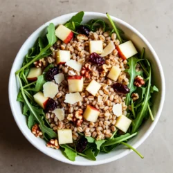 - 1 cup farro - 2 cups water or vegetable broth - 1 large tart apple, diced - 1/2 cup freshly grated Parmesan cheese - 1/4 cup walnuts, roughly chopped - 1/4 cup dried cranberries - 2 cups arugula or mixed salad greens - 3 tablespoons extra virgin olive oil - 2 tablespoons apple cider vinegar - 1 teaspoon honey or maple syrup - Salt and freshly ground black pepper To make this Apple Parmesan Farro Salad, gather these fresh ingredients. Start with farro, a nutty grain that adds great texture. Use water or vegetable broth for cooking it, which enhances flavor. Choose a tart apple like Granny Smith for a nice zing. Freshly grated Parmesan cheese gives a creamy touch that pairs well with the apple. Next, add walnuts for crunch and dried cranberries for sweetness. Arugula or mixed greens add freshness and color. Finally, you&rsquo;ll need extra virgin olive oil, apple cider vinegar, honey (or maple syrup), and salt and pepper to make a simple yet tasty dressing. These ingredients work together to create a vibrant and satisfying salad. The mix of flavors and textures makes each bite exciting. You can adjust the amounts based on your taste. Enjoy the process of cooking and the joy of sharing this delicious dish! {{ingredient_image_2}} First, rinse 1 cup of farro under cold running water. This step removes any dust or debris. Next, boil 2 cups of water or vegetable broth in a medium saucepan. When the liquid reaches a rolling boil, add the rinsed farro. Reduce the heat to low and cover the pot. Let it gently simmer for about 30 minutes. The farro should become soft yet still chewy. After cooking, drain any extra liquid and spread the farro on a plate to cool for around 10 minutes. While the farro cools, prepare the dressing. In a small bowl, combine 3 tablespoons of extra virgin olive oil, 2 tablespoons of apple cider vinegar, 1 teaspoon of honey or maple syrup, a pinch of salt, and freshly cracked black pepper. Whisk these ingredients together until they blend well. This dressing brings a tangy flavor that pairs nicely with the salad. In a large mixing bowl, combine the cooled farro, diced apple, freshly grated Parmesan cheese, chopped walnuts, and dried cranberries. Use a large spoon to mix everything together evenly. This ensures that each bite has a bit of every ingredient. Next, drizzle the prepared dressing over the salad and toss gently. You want every piece to be coated without squishing the ingredients. For a fresh touch, fold in 2 cups of arugula or mixed salad greens. This adds color and a nice crunch to the dish. The greens also provide a lovely contrast to the hearty farro and sweet apples. Before serving, taste the salad. Adjust the seasoning by adding more salt, black pepper, or a bit more honey if you like it sweeter. Presentation matters! Serve the salad in a large, shallow bowl. You can garnish it with extra grated Parmesan and some reserved walnut pieces for an appealing look. A sprig of fresh arugula in the center makes it even prettier. Enjoy your vibrant Apple Parmesan Farro Salad! If you cannot find farro, you can easily swap it for quinoa or barley. Quinoa cooks fast and adds a nice fluffy texture. Barley gives a chewier bite and a nutty flavor. For the apples, you have options! Use Granny Smith for a tart kick or Honeycrisp for a sweeter crunch. Both choices work great in this salad. Want to amp up the flavor? Try adding fresh herbs like parsley or basil. A sprinkle of cumin or smoked paprika can also boost the taste. For toppings, consider adding sliced avocado, toasted pecans, or even feta cheese. Each adds a unique twist to your salad. Presentation matters! Serve your salad in a wide, shallow bowl. This allows the colors to shine through. Garnish with extra grated Parmesan on top. A few whole walnuts and a sprig of fresh arugula can make your dish look even more appealing. The visual will make everyone excited to dig in! Pro Tips Choose the Right Apple: For this salad, opt for tart apple varieties like Granny Smith or Honeycrisp. Their acidity balances the richness of the Parmesan and the sweetness of the cranberries. Toast the Walnuts: To enhance the flavor and crunch of the walnuts, toast them in a dry skillet over medium heat for 5-7 minutes until golden and fragrant before adding them to the salad. Make it Ahead: This salad can be prepared ahead of time. Just store the dressing separately in the fridge and combine everything just before serving to keep the greens crisp. Adjusting Sweetness: Taste the dressing before adding it to the salad. If you prefer a sweeter dressing, feel free to add a little more honey or maple syrup to suit your palate. {{image_4}} You can change this salad based on the season. Try using fruits that are fresh and local. In the fall, add slices of pear or pomegranate seeds. In the summer, use peaches or cherries for a burst of sweetness. Consider swapping walnuts for pecans or hazelnuts. These options add crunch and flavor. If you need a gluten-free option, replace farro with quinoa or brown rice. Both grains work well and keep the dish light. For a vegan version, skip the Parmesan cheese. Use dairy-free cheese or nutritional yeast instead. This keeps the salad creamy while staying plant-based. To switch up flavors, try different dressings. A balsamic vinaigrette adds a tangy kick. A honey mustard dressing brings in a sweet and savory mix. You can even add spices like cumin or paprika for extra depth. These changes keep the salad exciting and fresh each time you make it. To keep your Apple Parmesan Farro Salad fresh, store it in the fridge. Use an airtight container. The salad tastes best within three days. If you have leftovers, keep the dressing separate. This way, the salad won&rsquo;t get soggy. When you want to eat it, just drizzle the dressing on top before serving. If you want to save the salad for longer, consider freezing the farro. Cook the farro and let it cool completely. Then, place it in a freezer-safe bag. Remove as much air as possible before sealing. You can freeze it for up to three months. When ready to use, thaw it in the fridge overnight. To warm up farro, use the stovetop or microwave. If using the stovetop, add a splash of water. Heat it on low until warm. If using the microwave, place the farro in a bowl with a bit of water. Cover it and heat for about one minute. Stir and check the warmth. This method keeps the texture nice and chewy. Yes, you can make this salad in advance. The farro cooks well and keeps its texture. You can store it in the fridge for up to three days. I recommend waiting to add arugula until just before serving. This keeps it fresh and crisp. If you want to impress guests, prepare the salad a day early. The flavors blend nicely when sitting. For this salad, I suggest using tart apples. Granny Smith and Honeycrisp are great choices. They balance the salty Parmesan nicely. These apples add a refreshing crunch that brightens the dish. Avoid sweet apples like Red Delicious; they can make the salad too sugary. To make this salad heartier, add protein. Grilled chicken or shrimp works well. You can also use chickpeas or black beans for a vegetarian option. Nuts like almonds or extra walnuts add crunch and protein too. These additions will make your salad a full meal, not just a side dish. No, farro is not gluten-free. It is a type of wheat. If you need a gluten-free option, try quinoa or brown rice. Both alternatives have a similar texture and flavor. They work well in this salad and will make it just as tasty. This article covered a tasty Apple Parmesan Farro Salad. You learned about the main and additional ingredients, including tips for dressing and variations. I shared steps to cook farro, mix in ingredients, and create a great salad. Remember, you can change the salad to fit your tastes and dietary needs. Enjoy exploring different flavors and making this meal your own. Try it out, and share it with friends. A fresh salad like this can brighten any day!